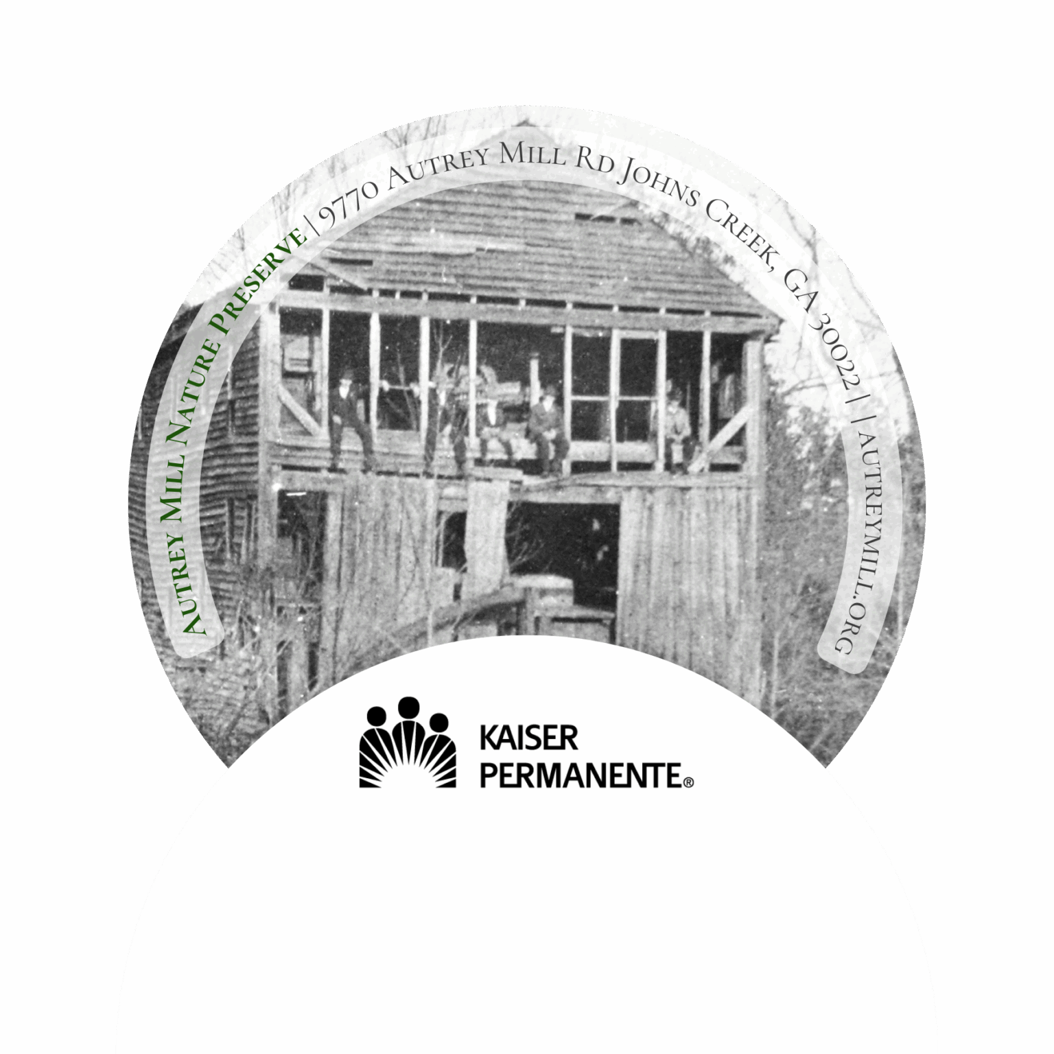 Picture of a round rubber backed jar opener with the Kaiser Permanente Logo and a picture of the old Autrey Mill from 1914 with the Green brothers sitting on the Mill Ruins.